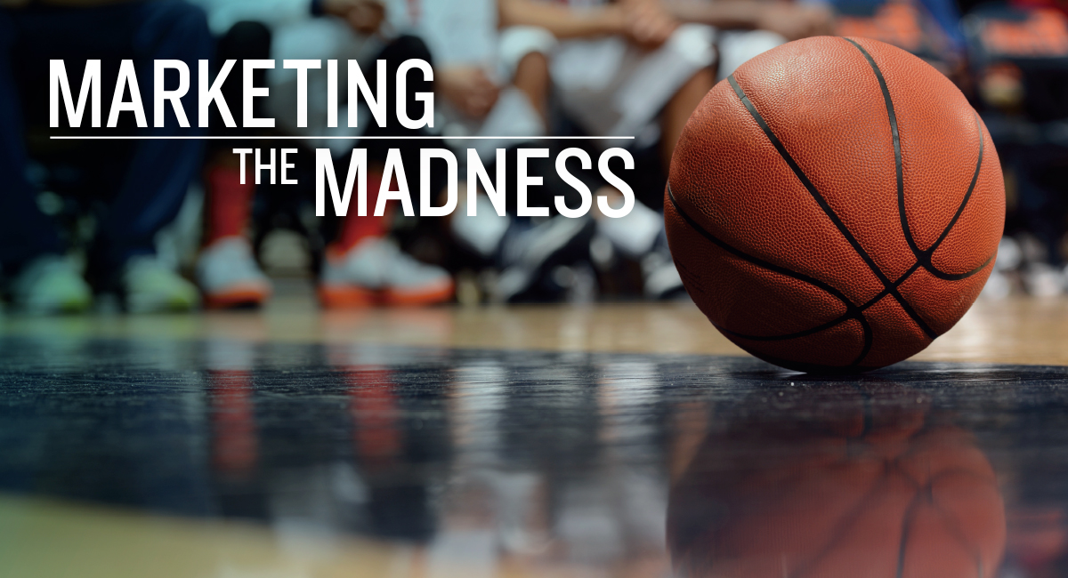 Basketball on a gym floor, with crowd in the background, and text that reads "marketing the madness."